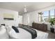 Well-lit primary bedroom with stylish furniture and outdoor views at 20802 N Grayhawk Dr # 1123, Scottsdale, AZ 85255