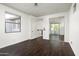Bedroom with hardwood floors, access to ensuite bathroom, and a large window at 20802 N Grayhawk Dr # 1123, Scottsdale, AZ 85255