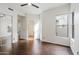 Bright bedroom with wood floors, mirrored closet and a window allowing natural light at 20802 N Grayhawk Dr # 1123, Scottsdale, AZ 85255