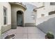 Charming courtyard entrance with tiled flooring and desert landscaping at 20802 N Grayhawk Dr # 1123, Scottsdale, AZ 85255
