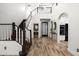 Dramatic foyer with soaring ceilings, prominent staircase, and archways leading to kitchen and living areas at 20802 N Grayhawk Dr # 1123, Scottsdale, AZ 85255
