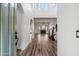 Welcoming foyer flows into a large living space featuring wood floors, and a brick fireplace at 20802 N Grayhawk Dr # 1123, Scottsdale, AZ 85255
