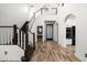 Dramatic foyer with soaring ceilings, prominent staircase, and archways leading to kitchen and living areas at 20802 N Grayhawk Dr # 1123, Scottsdale, AZ 85255