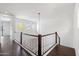 Hallway with staircase, ceiling light, and windows overlooking neighborhood at 20802 N Grayhawk Dr # 1123, Scottsdale, AZ 85255