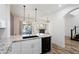 Open kitchen space with granite counters, stainless steel appliances, and a view to the living area at 20802 N Grayhawk Dr # 1123, Scottsdale, AZ 85255