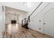 Spacious living room featuring natural light, a fireplace, and staircase at 20802 N Grayhawk Dr # 1123, Scottsdale, AZ 85255