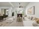 Inviting living room with a cozy fireplace, plush seating, and views of the outdoors at 20802 N Grayhawk Dr # 1123, Scottsdale, AZ 85255