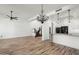 Bright, open-concept living space with staircase, and chef's kitchen featuring white cabinets at 20802 N Grayhawk Dr # 1123, Scottsdale, AZ 85255