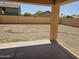 Backyard with neutral gravel and a covered patio at 20941 N Leona Blvd, Maricopa, AZ 85138