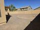 Spacious backyard with gravel landscaping and a concrete border at 20941 N Leona Blvd, Maricopa, AZ 85138