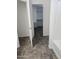 Bathroom features tile floor, door to closet, and white tile shower at 20941 N Leona Blvd, Maricopa, AZ 85138