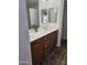 Dual sinks sit in front of a large mirror in this bathroom at 20941 N Leona Blvd, Maricopa, AZ 85138