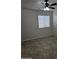 Neutral bedroom with tile flooring, ceiling fan, and a bright window at 20941 N Leona Blvd, Maricopa, AZ 85138