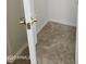 Home closet with white door and gold handle at 20941 N Leona Blvd, Maricopa, AZ 85138