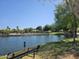 Picturesque community lake view, showcasing walking paths and recreation area at 20941 N Leona Blvd, Maricopa, AZ 85138