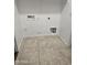 Laundry room with tile floors and hookups for appliances at 20941 N Leona Blvd, Maricopa, AZ 85138