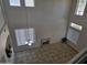 Bright living room with high ceilings, lots of natural light, and tiled flooring at 20941 N Leona Blvd, Maricopa, AZ 85138
