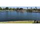 Community pond area with grassy banks and picnic tables by the clubhouse at 20941 N Leona Blvd, Maricopa, AZ 85138
