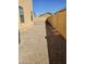 Side yard featuring gravel ground cover and a block wall for privacy at 20941 N Leona Blvd, Maricopa, AZ 85138