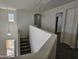 Bright staircase with natural light and open landing at 20941 N Leona Blvd, Maricopa, AZ 85138