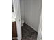 A half bathroom with tile floors, a toilet and dark brown vanity at 20941 N Leona Blvd, Maricopa, AZ 85138