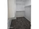 Walk-in closet with carpet and white shelving and trim at 20941 N Leona Blvd, Maricopa, AZ 85138