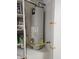 Utility closet with a modern water heater unit and visible piping at 20941 N Leona Blvd, Maricopa, AZ 85138