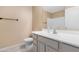 A well-lit bathroom with a white vanity and toilet at 22576 N Davis Way, Maricopa, AZ 85138