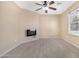 Neutral bedroom with tile flooring and electric fireplace at 22576 N Davis Way, Maricopa, AZ 85138