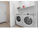 Functional laundry room with a washer and dryer at 22576 N Davis Way, Maricopa, AZ 85138