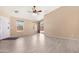 Bright living room features tiled floors and sliding door access to the backyard at 22576 N Davis Way, Maricopa, AZ 85138