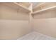 Walk-in closet features built-in shelving at 22576 N Davis Way, Maricopa, AZ 85138