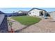 Spacious backyard featuring a well-maintained lawn and a playset at 23937 W Hopi St, Buckeye, AZ 85326