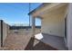Backyard features a covered patio, providing an ideal outdoor space for relaxing and entertaining at 23937 W Hopi St, Buckeye, AZ 85326