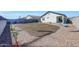 The backyard features a blank canvas, freshly tilled garden, and ample space for outdoor activities at 23937 W Hopi St, Buckeye, AZ 85326