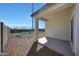 Backyard features a covered patio, providing an ideal outdoor space for relaxing and entertaining at 23937 W Hopi St, Buckeye, AZ 85326