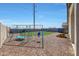 The backyard offers outdoor space with a playground set, perfect for Gathering activities at 23937 W Hopi St, Buckeye, AZ 85326