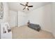 Bright bedroom features a ceiling fan and natural light at 23937 W Hopi St, Buckeye, AZ 85326
