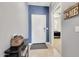 Inviting entryway with neutral walls and tile flooring with view to main bedroom at 23937 W Hopi St, Buckeye, AZ 85326