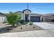 Charming single-story home featuring a well-manicured yard and a two-car garage at 23937 W Hopi St, Buckeye, AZ 85326