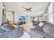 Open-concept living room flows into the kitchen and dining area at 23937 W Hopi St, Buckeye, AZ 85326