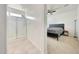 This bedroom offers an ensuite bathroom featuring a modern shower with glass doors and updated fixtures at 23937 W Hopi St, Buckeye, AZ 85326