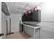 Basement with painted walls, storage cabinets, work bench, and speckled flooring at 2400 E Baseline Ave # 228, Apache Junction, AZ 85119