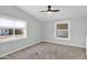 Bright bedroom featuring neutral paint, carpet, and ample natural light from windows at 2400 E Baseline Ave # 228, Apache Junction, AZ 85119