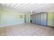 Large bonus room featuring a fan, built in storage cabinets, and neutral tile flooring at 2400 E Baseline Ave # 228, Apache Junction, AZ 85119