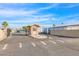 Gated entrance to the community with a welcome sign and well-maintained landscaping, ensuring security and curb appeal at 2400 E Baseline Ave # 228, Apache Junction, AZ 85119