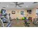 Fully-equipped gym with modern exercise machines, weights, and a TV for residents to maintain an active lifestyle at 2400 E Baseline Ave # 228, Apache Junction, AZ 85119