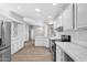 Bright kitchen featuring white cabinets, modern appliances, and a view of the dining area at 2400 E Baseline Ave # 228, Apache Junction, AZ 85119