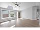 Light-filled living room with hardwood floors, neutral paint, and ample natural light at 2400 E Baseline Ave # 228, Apache Junction, AZ 85119