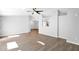 Open-concept living room with hardwood flooring, neutral paint, and views into the dining room at 2400 E Baseline Ave # 228, Apache Junction, AZ 85119